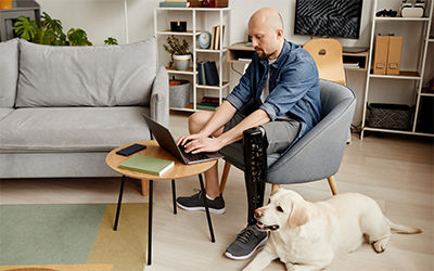 Man checking his account on a laptop at home