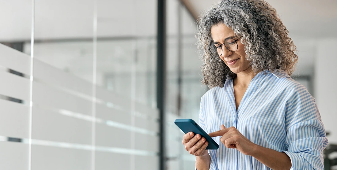 Woman viewing her personal account on her smart phone