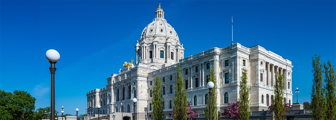 Minnesota State Capitol with flowering trees in the foreground