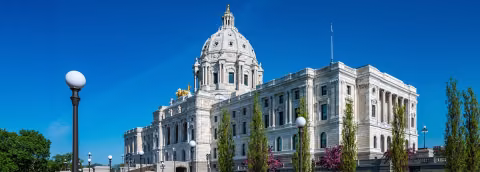Minnesota State Capitol with flowering trees in the foreground